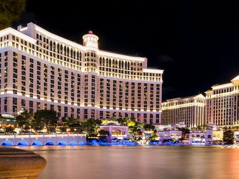 Bellagio tower and lake with fountains at sunset
