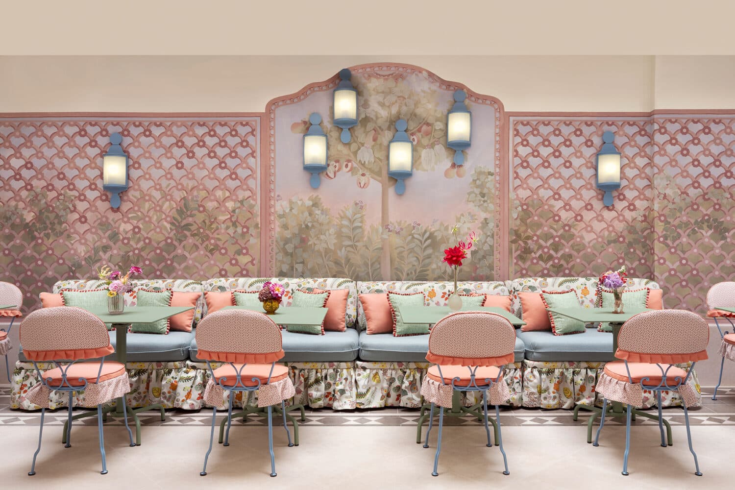 Le Grand Mazarin winter garden lounge with patterned seating and greenery